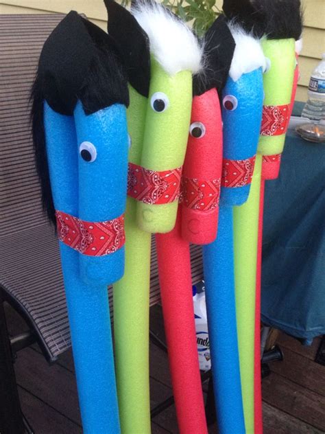  The ears are then taped side by side on the top the head with a piece of pool noodle in between the head and ears